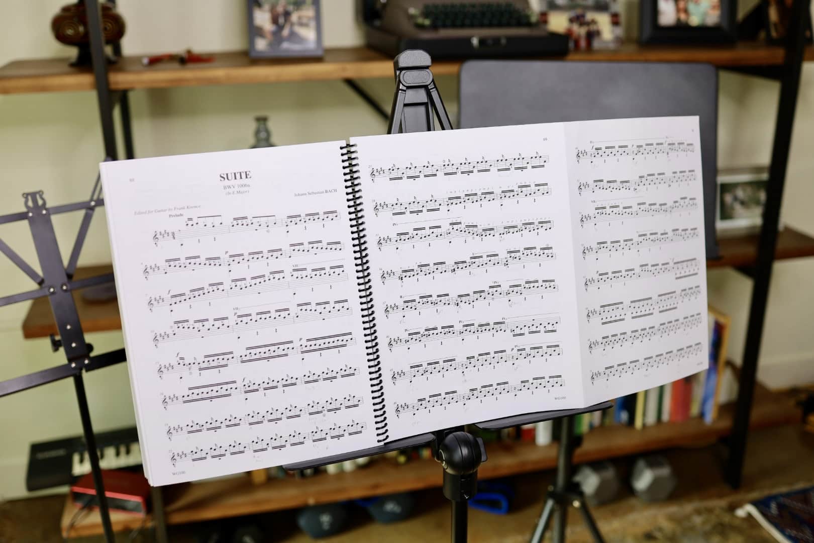 Capsule music stand with Bach score and other music stands in background